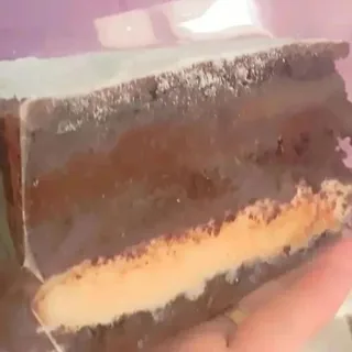 Fatia Dueto de Amor com brigadeiro de Leite Ninho, Nutella e massa de chocolate